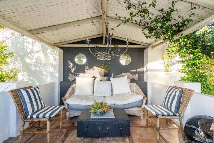 Candle-lit gazebo lounge for evenings by the pool